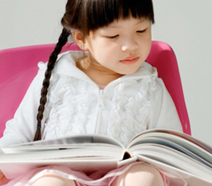 Children Reading Books With Parents