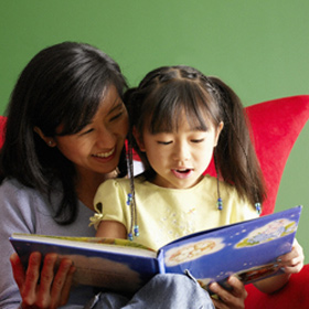 Children Reading Books With Parents