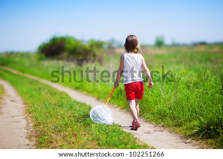 Little Children Playing In The Park Catching Butterflies