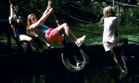 Little Children Playing In The Park Catching Butterflies