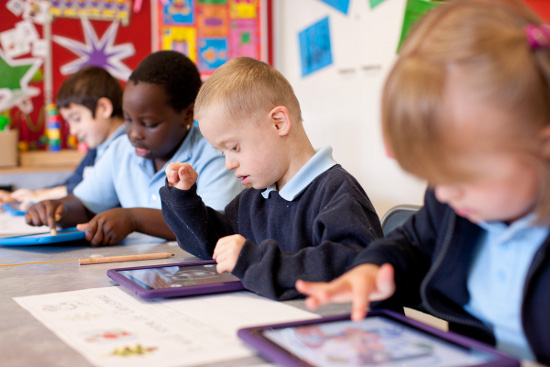Teacher Using Technology In The Classroom